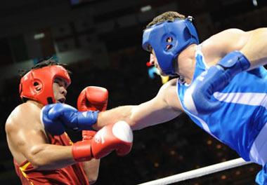 Roberto Cammarelle (blue) of Italy fights with Zhang Zhilei of China during men's heavy (+91kg) final bout at the Beijing Olympic Games boxing event in Beijing, China, Aug. 24, 2008. Roberto Cammarelle won the match and got the gold medal in the event. (Xinhua Photo)
