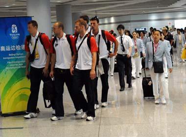 Members of different Olympic delegations walk to a frontier inspection counter at the Beijing Capital International Airport in Beijing, capital of China, Aug. 25, 2008. The airport saw a peak traffic volume on Monday as many Olympic delegations left the Chinese capital. A total of 32,596 passengers would leave Beijing throughout the day, doubling the usual figure. [Xinhua]