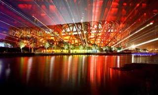 Photo taken on Aug. 22, 2008 shows the nightscape of the National Stadium, also known as the Bird's Nest, in Beijing. The Olympic Green enjoys a beautiful night view shining with colors and lights during the Beijing 2008 Olympic Games. [Xinhua]