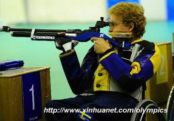 Jonas Jacobsson of Sweden competes in the men's R1-10m air rifle standing SH1 final of shooting event during Beijing 2008 Paralympic Games in Beijing, Sept. 8, 2008. Jonas Jacobsson won the gold with a total score of 700.5. (Xinhua/Ren Yong)