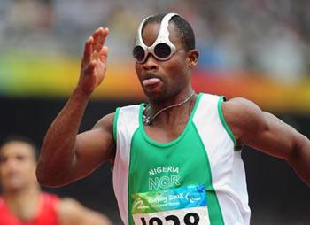 Nigeria's Adekunle Adesoji competes during the semifinal of men's 100m T12 of the Beijing 2008 Paralympic Games, at the National Stadium, also known as the Bird's Nest, in Beijing, China, Sept. 9, 2008. Adesoji took the first place of his group with a time of 11.00 seconds and advanced into the final. (Xinhua Photo)