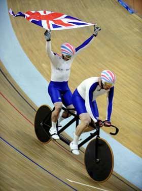 British Anthony Kappes(L) and his pilot Barney Storey celebrate after claiming the title of Men's Sprint(B&VI) final of the Beijing 2008 Paralympic Games cycling track event on Sept. 10, 2008.(Xinhua/zhang Duo) 