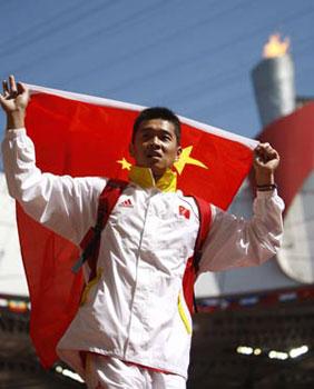 China's Guo Wei jubilates after men's discus F35/36 final at the National Stadium, also known as the Bird's Nest, during the Beijing 2008 Paralympic Games in Beijing, Sept. 11, 2008. Guo won the gold medal with 54.13 meters and set a new world record. (Xinhua Photo)