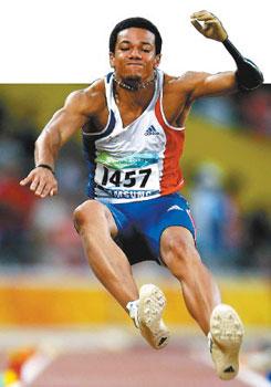 Arnaud Assoumani of France snares gold in the the final of the men's long jump F46 classification event.