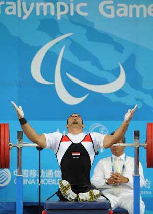 Sherif Othman Othman of Egypt reacts during the men's 56kg final at the Beijing 2008 Paralympic Games Powerlifting event in Beijing, Sept. 11, 2008. Othman broke the world record and claimed the title with 202.5kg. (Xinhua Photo)