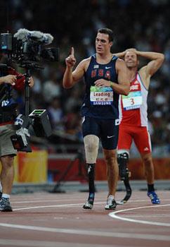 Jeremy Campbell of the United States (L) celebrates after the 400m competition of men's pentathlon P44 at the National Stadium，also known as the Bird's Nest，during the Beijing 2008 Paralympic Games in Beijing, Sept. 11, 2008. Jeremy Campbell won the gold medal of the event. (Xinhua/Guo Dayue)