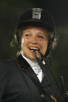 Bettina Eistel of Germany reacts as she watches the scoreboard after competing with Fabuleux 5 in the equestrian individual championship test grade III at the Beijing 2008 Paralympics Games in Hong Kong September 9, 2008. [Agencies]