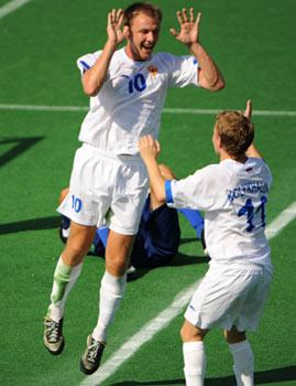 Russia's Andrey Kuvaev (Top) celebrates with his teammate after scoring during the Group A preliminary of men's 7-a-side football at the Beijing 2008 Paralympic Games in Beijing, China, Sept. 12, 2008. Russia beat Brazil 3-0.(Xinhua/Guo Yong)