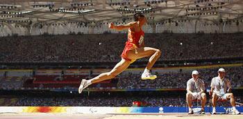 Li Duan of China competes during the men's triple jump F11 final at the National Stadium??also known as the Bird's Nest??during the Beijing 2008 Paralympic Games in Beijing, China, Sept. 12, 2008. Li won the title with 13.71 meters. [Photo: Xinhua]