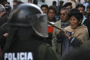 A supporter of Bolivia's President, Evo Morales, shouts slogans against Tarija's governor Mario Cossio as he arrives at the Government Palace in La Paz September 12, 2008. Violent anti-government protests have killed eight people in Bolivia, where rightist governors have rebelled against the popular president demanding autonomy and rejecting his plans to overhaul the constitution and break up ranches to give land to poor Indians.(Ivan Alvarado/Reuters) 