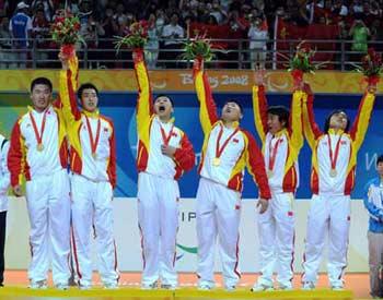 Players of China celebrate their victory during the awarding ceremony for the men's goalball final at the Beijing 2008 Paralympic Games in Beijing, China, Sept. 14, 2008. China defeated Lithuania 9-8 and won the gold medal.(Xinhua Photo)