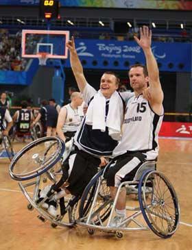 German players wave to spectators after a match of the classification 5th-8th against Japan of men's wheelchair basketball event during the Beijing 2008 Paralympic Games in Beijing, China, Sept. 15, 2008. Germany defeated Japan in the match 71-57.(Xinhua Photo)