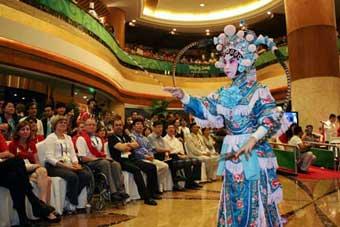 An actor performs Peking Opera during the Mid-Autumn soiree in Beijing, capital of China, Sept. 14, 2008. Some officials and athletes of Beijing Paralympic Games and some foreign guests attended a soiree on Sunday night to celebrate the Mid-Autumn Festival, a traditional Chinese festival for family reunions, by enjoying traditional Chinese culture. (Xinhua Photo)
