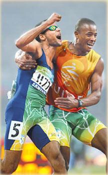 Brazil's Lucas Prado, left, and his guide celebrate after winning the men's 100m T11 last Tuesday. They went on to win the men's 200m T11 final on Saturday. Yang Shizhong