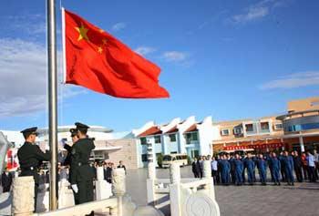 This file photo dated on Aug. 29, 2008 shows Chinese taikonauts, Liu Boming and Jing Haipeng attending a flag-raising ceremony at the Jiuquan Satellite Launch Center in Gansu Province of northwestern China. The Shenzhou-7 spaceship will carry three taikonauts Zhai Zhigang, Liu Boming and Jing Haipeng for China's third manned space mission that will feature China's 