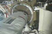Astronaut exits orbital module 1