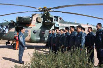 A colonel of special rescuing helicopters team addresses a mobilizing ceremony in the area awaiting for emergency missions of the main landing field of the Shenzhou-7 spacecraft in Siziwang Banner (county), north China's Inner Mongolia Autonomous Region, where the spacecraft is expected to land as it returns to the earth, on Sept. 26, 2008. (Xinhua Photo)