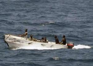 Pirates leave the merchant vessel MV Faina (not shown) for the Somali shore, while under observation by a U.S. Navy ship, in this picture taken on October 8, 2008 and released October 9.REUTERS/Jason R. Zalasky/U.S. Navy/Handout (SOMALIA)