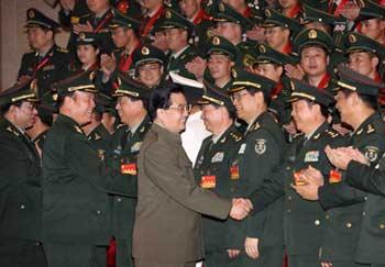 Chinese President Hu Jintao (1st. Front) meets with officers at a ceremony to honor outstanding organizations and individuals for their contributions to the May 12 earthquake rescue and relief work at the Great Hall of the People in Beijing, capital of China, on Oct. 8, 2008.(Xinhua/Wang Jianmin)