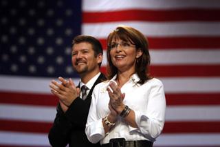 U.S. Republican vice presidential nominee Alaska Governor Sarah Palin and her husband Todd attend at a rally in Virginia Beach, Virginia Oct. 13, 2008.(Xinhua/Reuters Photo)