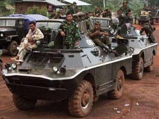Cambodian soldiers sit on an armored vehicle at Sraem village in Preah Vihear province, 543 km (337 miles) north of Phnom Penh, October 16, 2008.REUTERS/Chor Sokunthea (CAMBODIA)