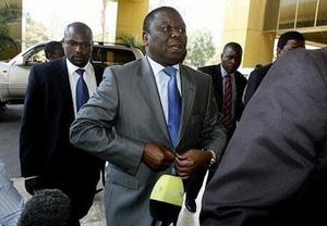 Movement for Democratic Change (MDC) leader Morgan Tsvangirai arrives for power-sharing talks in Harare on October 15, 2008.(AFP/File/Desmond Kwande)