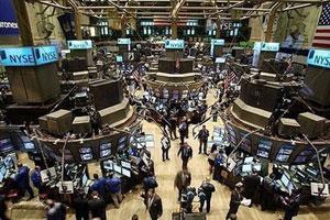 Traders work on the floor of the New York Stock Exchange (NYSE) moments after the opening bell in New York City. Panic-selling returned to global stock markets on Wednesday, with the leading Dow Jones industrial index shedding 5.6 percent, as fears of global recession stalked investors.(AFP/Getty Images/Spencer Platt)