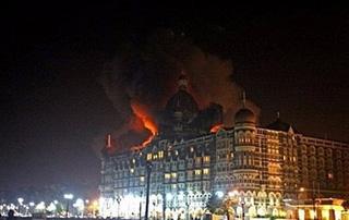 A fire breaks out of the dome of the Taj Mahal hotel in Mumbai. Nearly 80 people have been killed in a series of coordinated attacks across India's commercial capital Mumbai, as gunmen armed with assault rifles and grenades hit two luxury hotels and took foreign guests hostage.(AFP/Pal Pillai)