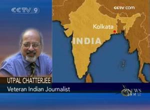 Veteran Indian Journalist, Utal Chatterjee, who is on the phone in India.(CCTV.com)