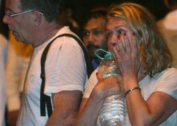 Foreign guests react after being rescued from the Taj Hotel in Mumbai November 27, 2008.REUTERS/Punit Paranjpe (Reuters)