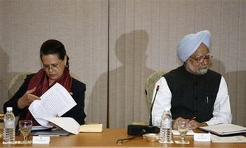 Congress Party president Sonia Gandhi, left, and Indian Prime Minister Manmohan Singh take part in a meeting of all political parties to discuss the Mumbai attacks in New Delhi, India, Sunday, Nov. 30, 2008. With corpses still being pulled from a once-besieged hotel, India's top security official resigned Sunday as the government struggled under growing accusations of security failures following terror attacks.(AP Photo/ Mustafa Quraishi)