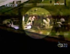 Mobile phone video obtained by news agencies shows the alleged arrest by security services of a gunman.(CCTV.com)