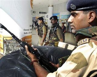 Indian paramilitary soldiers stand guard during heightened security checks at Chennai International airport in Chennai, India, Thursday, Dec. 4, 2008.(AP Photo)