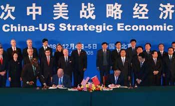 Chinese Vice Premier Wang Qishan (front R) and U.S. Treasury Secretary Henry Paulson attend the signing ceremony on energy and environmental protection cooperation during the fifth China-U.S. Strategic Economic Dialogue in Beijing, China, Dec. 4, 2008.(Xinhua/Pang Xinglei)