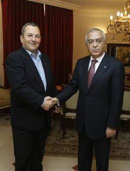 Israel's Defense Minister Ehud Barak, left, shakes hand with Palestinian Prime Minister Salam Fayyad during their meeting in Jerusalem, Sunday, Dec. 7, 2008.(AP Photo/Baz Ratner, Pool)