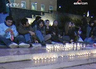 In the Greek capital of Athens, protesters held a candle light vigil outside parliament house on Friday night.