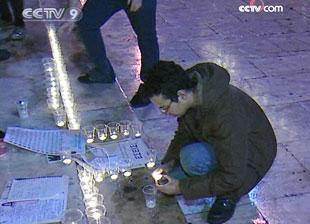 In the Greek capital of Athens, protesters held a candle light vigil outside parliament house on Friday night.