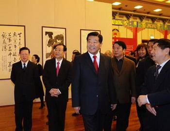 Jia Qinglin (C), member of the Standing Committee of the Communist Party of China Central Committee Political Bureau and chairman of the National Committee of the Chinese People's Political Consultative Conference (CPPCC), attends the opening ceremony of a calligraphy and painting exhibition commemorating the 30th anniversary of China's reform and opening up, in Beijing, capital of China, on Dec. 19, 2008. More than 200 works were on display, all by painters and calligraphers who also act as CPPCC members.(Xinhua/Li Tao)