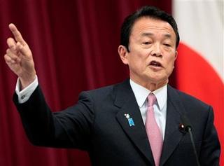 Japanese Prime Minister Taro Aso speaks during a yearend press conference at his official residence in Tokyo, Japan, Wednesday, Dec. 24, 2008.(AP Photo/Itsuo Inouye) 