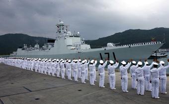 Chinese navy soldiers wave to the fleet as the naval ships depart from Sanya of South China's Hainan Province to Somalia on December 25, 2008.Two destroyers and a supply ship left a port in the southernmost island province of Hainan for Somalia at 1:50 p.m. Friday. They will cruise for about 10 days to arrive in the Gulf of Aden, joining the multinational patrol in one of the world's busiest sea lanes where surging piracy endangers international shipping. [Xinhua]