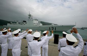 Chinese navy soldiers wave to the fleet as the naval ships depart from Sanya of South China's Hainan Province to Somalia on December 25, 2008.Two destroyers and a supply ship left a port in the southernmost island province of Hainan for Somalia at 1:50 p.m. Friday. They will cruise for about 10 days to arrive in the Gulf of Aden, joining the multinational patrol in one of the world's busiest sea lanes where surging piracy endangers international shipping. [Xinhua]