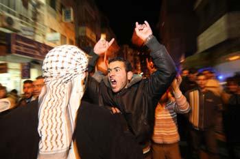 A Palestinian shouts slogans at a demonstration in downtown Ramallah against Israel's ground operation on the Gaza Strip, Jan 3, 2009. The Israel Defense Forces (IDF) began its ground incursion into the Hamas-controlled Gaza Strip since Jan. 3, and the airstrikes since Dec. 27, 2008 have left at least 450 Palestinian people dead and some 2,300 others wounded in the Gaza Strip by far. (Xinhua Photo)