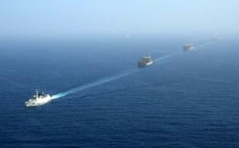 A ship of China Ocean Shipping Group Company (COSCO) sails in the Gulf of Aden under the escort of a Chinese naval fleet (not seen in the picture) Jan. 6, 2009. The Chinese naval fleet arrived Tuesday in the waters of the Gulf of Aden off Somalia to carry out the first escort mission against pirates. Four Chinese ships, including one from China's Hong Kong Special Administrative Region, were escorted by the fleet. (Xinhua Photo)