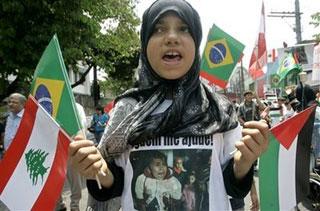 A girl shouts slogans during a protest against Israel's military strikes on Gaza in Sao Paulo, Wednesday, Jan. 7, 2009. (AP Photo/Nelson Antoine)