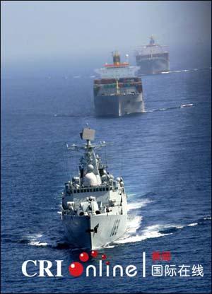 The Chinese Navy fleet completed its first escort mission off the coast of Somalia on Thursday, accompanying four cargo ships sailing through the Gulf of Aden.