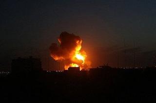A ball of fire is seen rising into the night sky following an Israel air strike in Rafah near the Gaza Strip's border with Egypt. (AFP/Said Khatib)