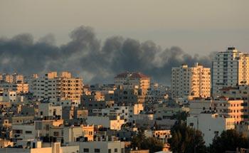 Smoke billows from Gaza City after Israeli artillery shellings Jan. 10, 2009. Residents in northern Gaza Strip said Saturday afternoon that Israeli warplanes dropped lots of leaflets in the area, warning the Palestinians that the military operations against them would be escalated. (Xinhua/Wissam Nassar)
