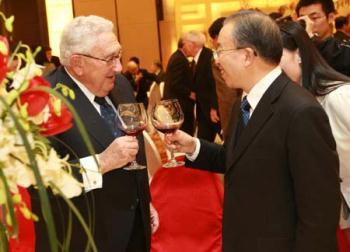 Chinese State Councilor Dai Bingguo (R) talks with former U.S. Secretary of State Henry Kissinger during a seminar in commemoration of the 30th anniversary of the establishment of diplomatic relations between China and the United States in Beijing, capital of China, Jan. 13, 2009. (Xinhua/Pang Xinglei)