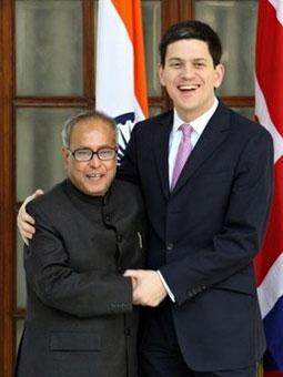 Indian Foreign Minister Pranab Mukherjee (left) shares a light moment with Foreign Secretary David Miliband in New Delhi on January 13.(AFP/File/Prakash Singh)