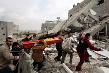 Mourners carry the body of a Palestinian killed during Israel's offensive, during his funeral in Beit Lahiya in the northern Gaza Strip January 17, 2009. Israeli bombardment killed two boys sheltering at a UN school and five other people in the Gaza Strip on Saturday, as Israel weighed a unilateral ceasefire to its three-week-old offensive against Hamas militants.[Agencies]